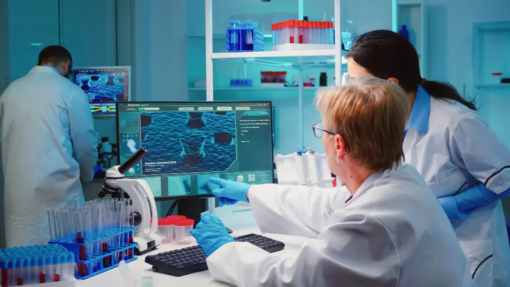 Researchers analysing DNA data in a laboratory